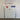 A white PVC double personnel door with an aluminium frame and a digital lock keypad and vertical locking bolt.